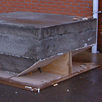 The concrete foundation block.